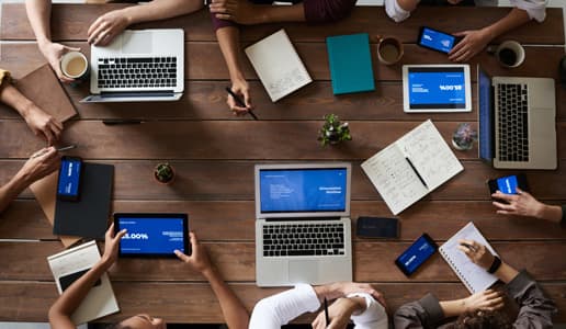 Agile team working together at a table.